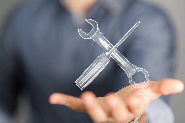 reimage repair overview man holding wrench and screwdriver in palm system optimizers repair software